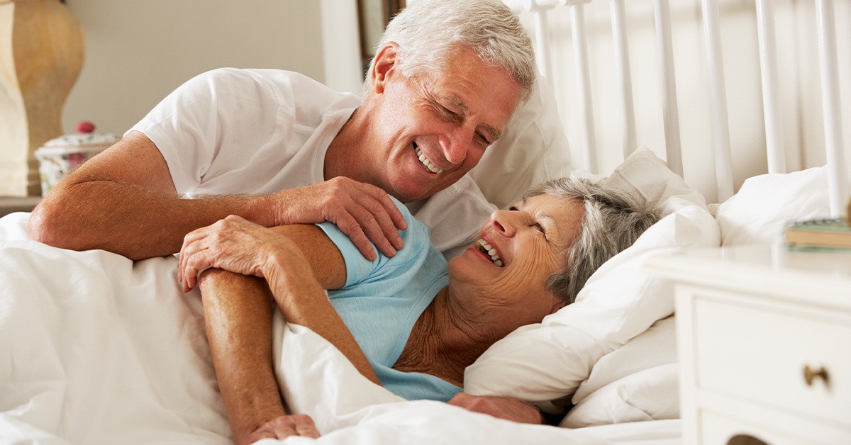 a man sleeping on a bed