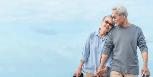 A Man Standing In Front Of Water