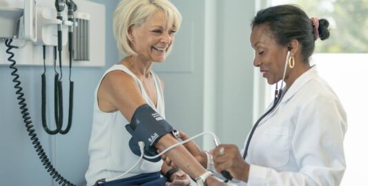 A Man And A Woman Standing In A Room