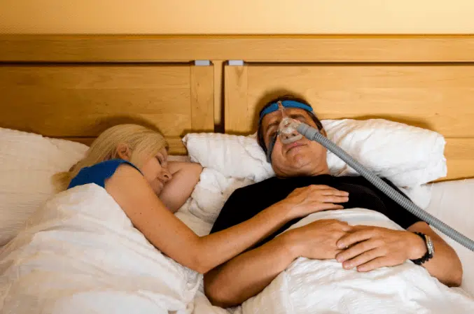 a person lying on a bed