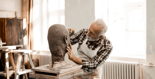 Man Pursuing His Passion In Sculpting