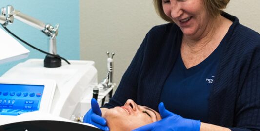 A Woman Sitting At A Table