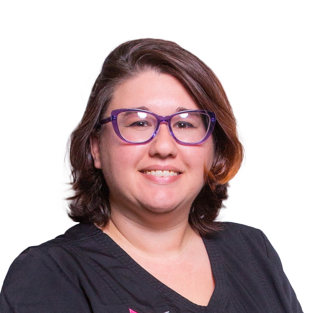 a person wearing glasses and smiling at the camera